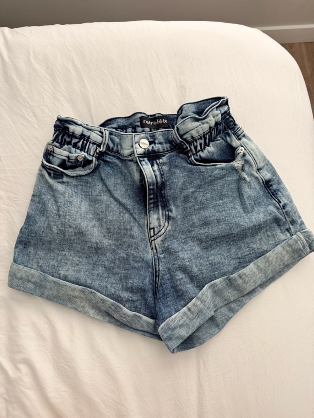 Retrofete Haisley Distressed Paperbag Waist Denim Shorts in Faded Blue Acid Wash